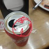 A Glass Shard Emerged from Coca-Cola Can