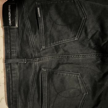 Calvin Klein Siyah Pantolon Renk Solması