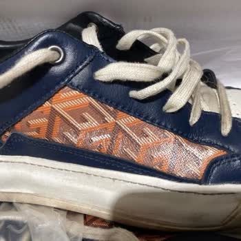 Premature Fading Issue with GUESS Shoes, No Exchange or Refund Provided