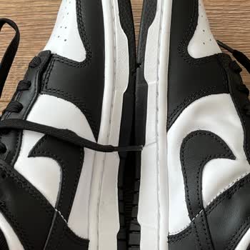 Problema con Nike Dunk Low Retro, Protrusión Visible, Solicito Reemplazo