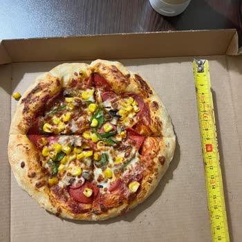 Pizza Hut Pizzas Más Pequeñas de lo Anunciado