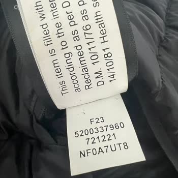 North Face Jacket Issues: Feather Leakage and Odor Persist After Replacement
