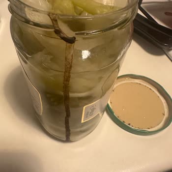 Migros Sanal Market'te Gıda Güvenliği Sorunu: Açık Kapağıyla Gelen Bozuk Turşu