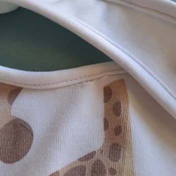 İlk Yıkamada Deforme Olan Bebek Önlüğü