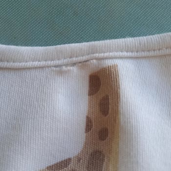 İlk Yıkamada Deforme Olan Bebek Önlüğü