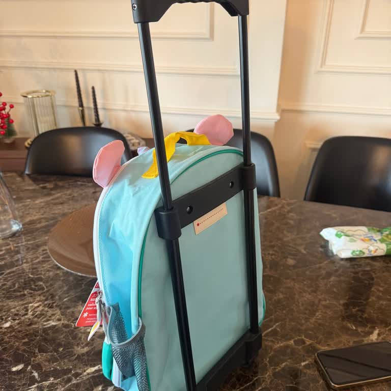 Skip Hop Rolling Luggage Handle Is Too Loose and Won’t Stay in Place