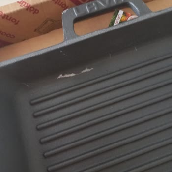 I Received a Damaged Lava Large Cast Iron Grill Pan with Coating Peeling Off