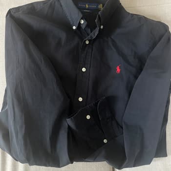 Problema de decoloración en camisa negra comprada en Ralph Lauren
