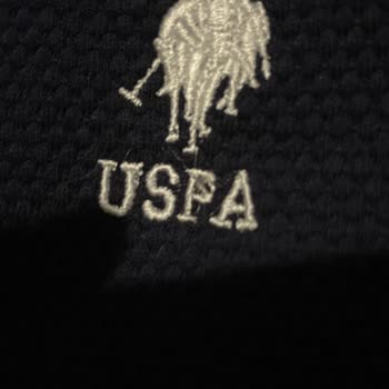 US Polo Tişörtte Sökük Logo Hayal Kırıklığı