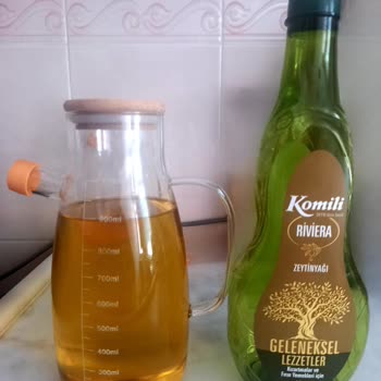 Komili Zeytinyağı 1L Şişede 100ml Eksik Doldurulmuş