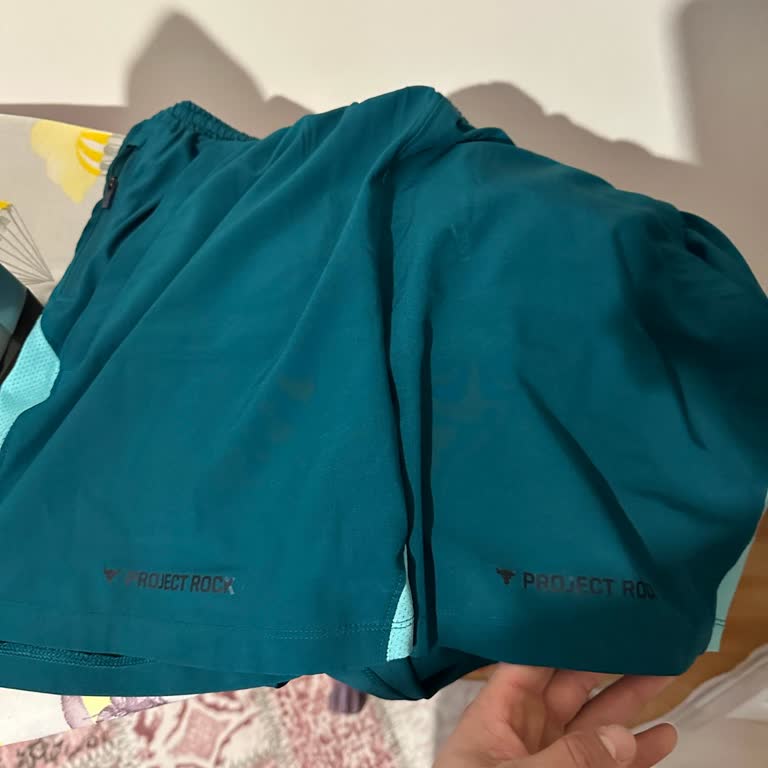 Under Armour Shorts Schriftzug nach wenigen Wäschen verschwunden