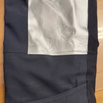 Impresión defectuosa y daños en chaqueta Decathlon, solicito cambio