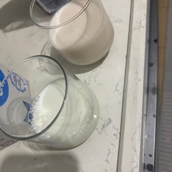 BİM Dost Laktozsuz Sütte Pembe Renk Sorunu Ve Bilgilendirme Talebi