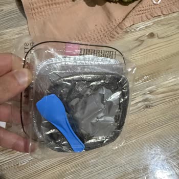 BİM Şubesinde Satın Alınan Sütlaçta Mavi Poşet Parçası Ve Siyahlaşma