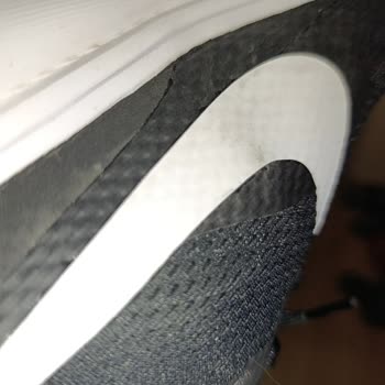 Nike Revolution 8 Logo Swelling After Few Wears - User Error Claim