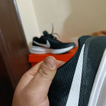 Nike Revolution 8 Logo Swelling After Few Wears - User Error Claim