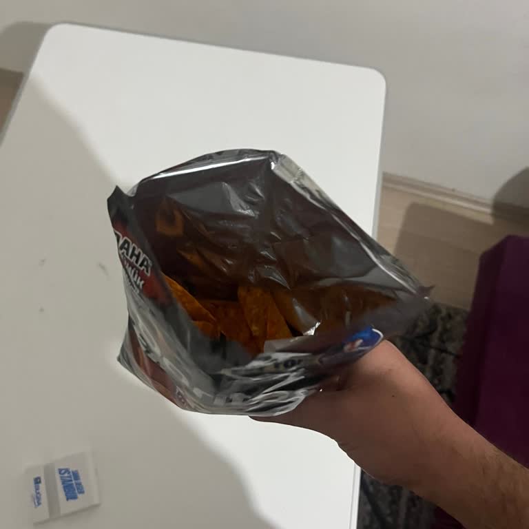 Encuentro sabor defectuoso y textura rancia en Doritos Mexicano