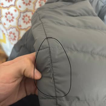 $285 North Face Jacket Shows Stitching, Stain, and Quality Defects