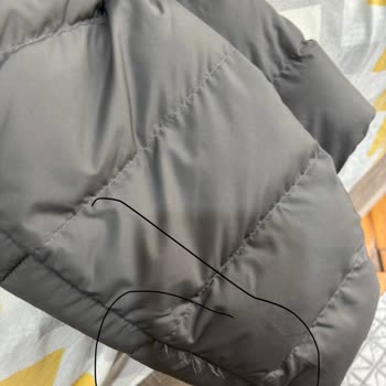 $285 North Face Jacket Shows Stitching, Stain, and Quality Defects