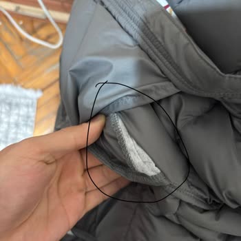 $285 North Face Jacket Shows Stitching, Stain, and Quality Defects