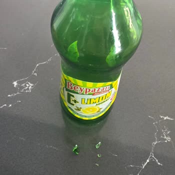 Cam Kırıkları İçeren Limon Aromalı Maden Suyu