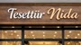 @Tesettunida Logo
