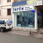 Üstün
